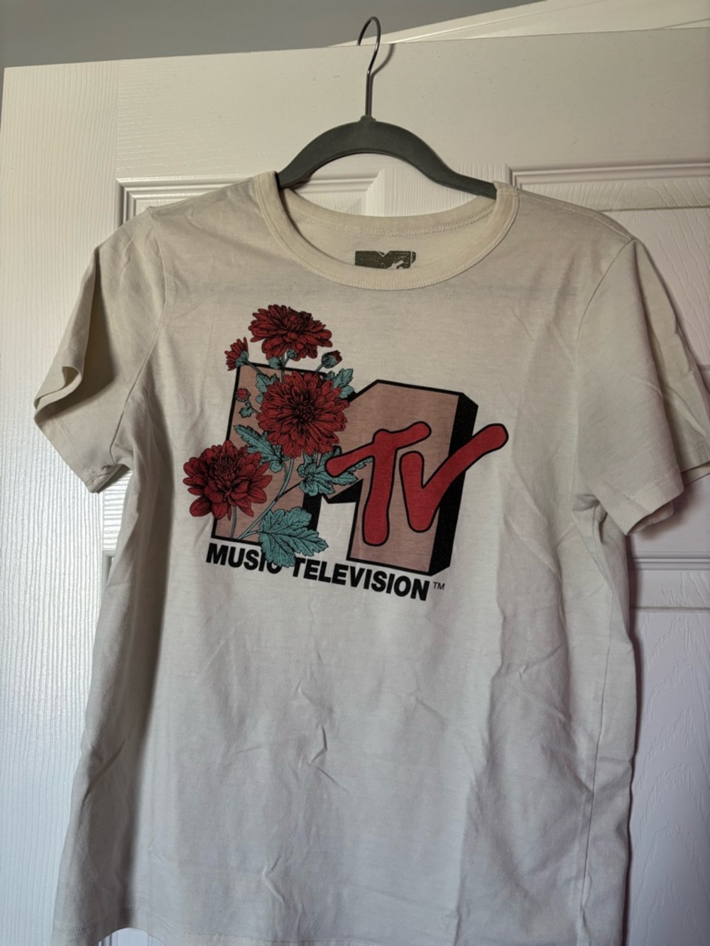 MTV Cream Tee with Red Floral Logo and Teal Leaves